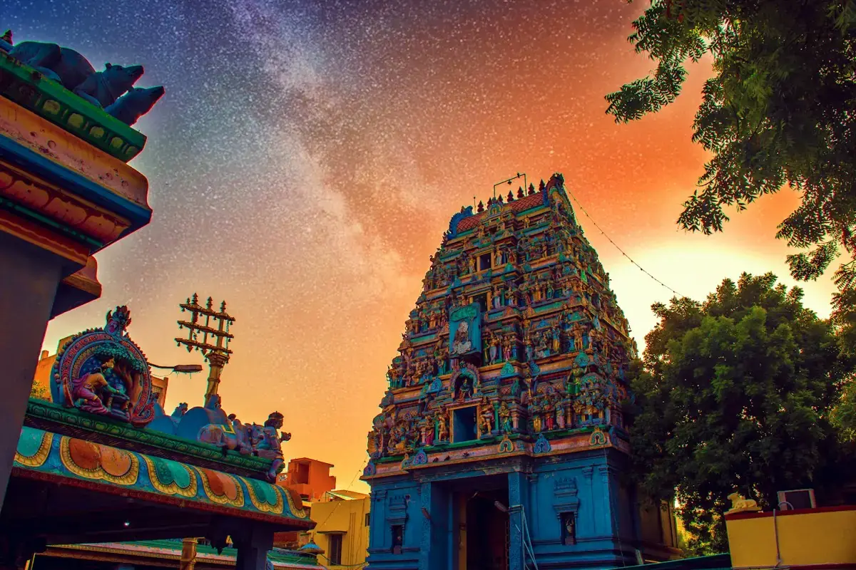 A temple gopuram in Chennai under a starry night sky