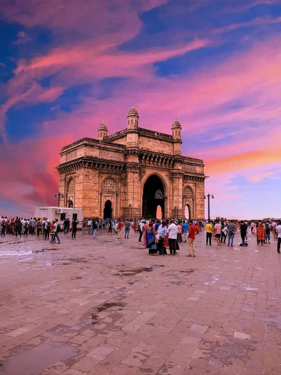 The Gateway of India in Mumbai under a pink evening sky